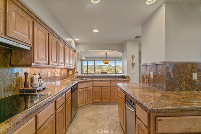 kitchen with light stone counters, stainless steel dishwasher, light tile patterned floors, black electric cooktop, and sink