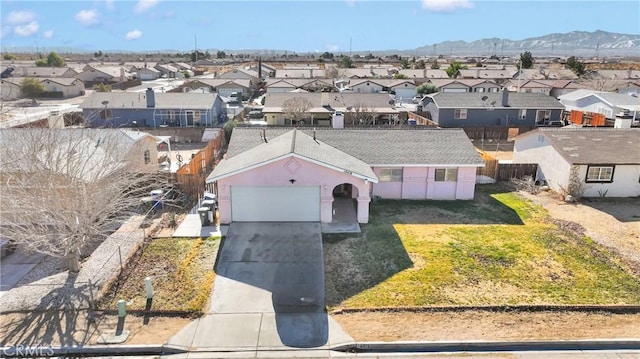 birds eye view of property with a mountain view