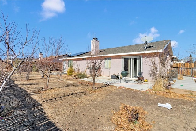 back of house with a patio area