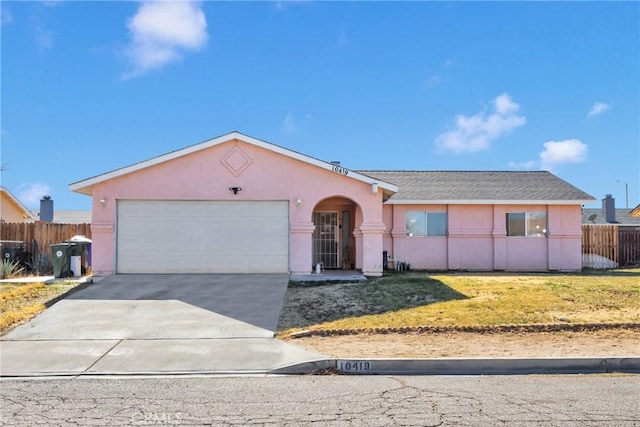 ranch-style house with a garage and a front lawn