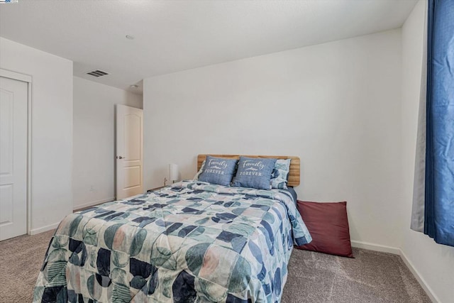 bedroom featuring light colored carpet