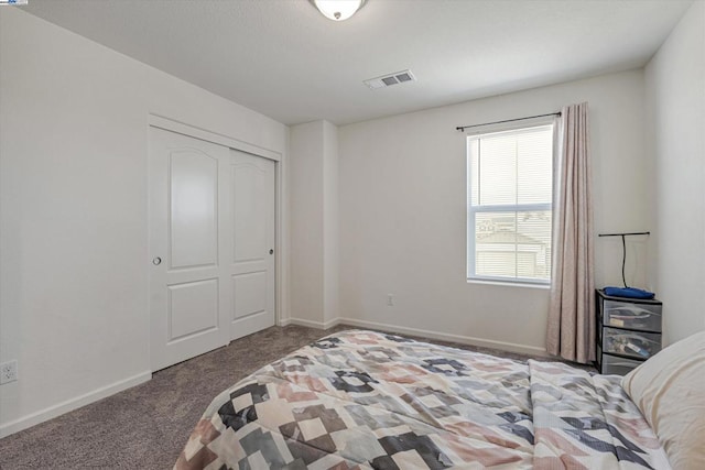 carpeted bedroom with a closet