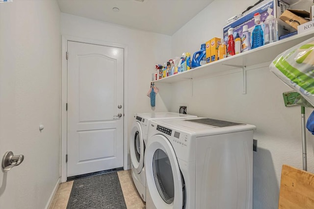 washroom with washer and dryer