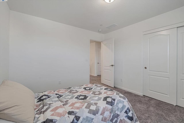 carpeted bedroom with a closet