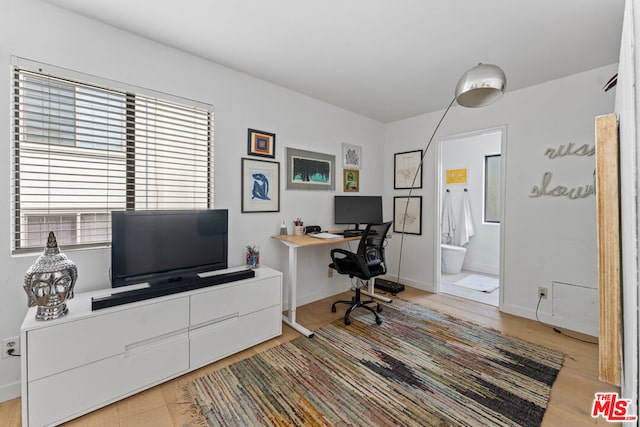 office space with light hardwood / wood-style flooring