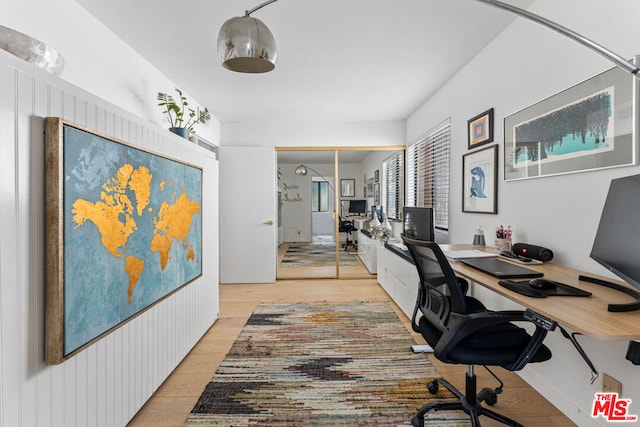 office space with light wood-type flooring