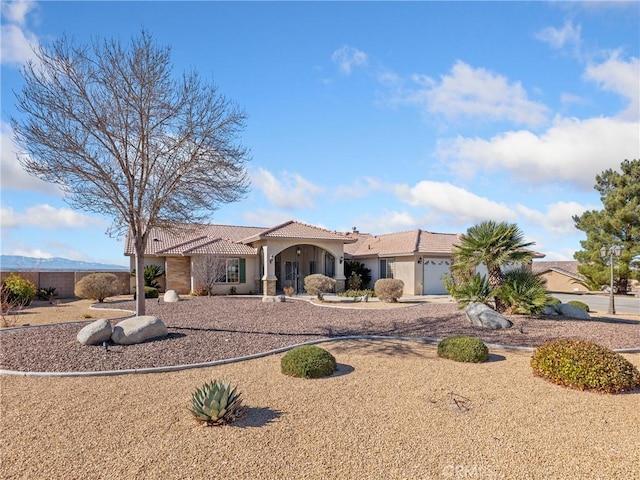 view of front of property with a garage