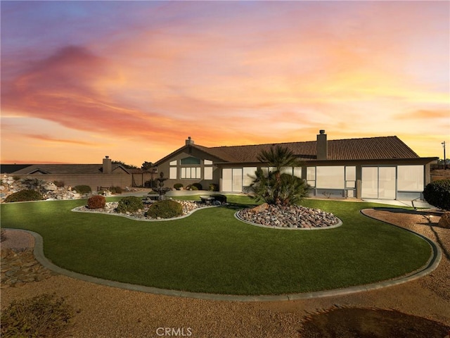 view of front of property with a lawn