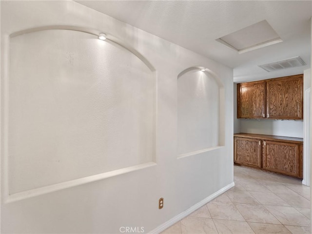 interior space featuring light tile patterned floors