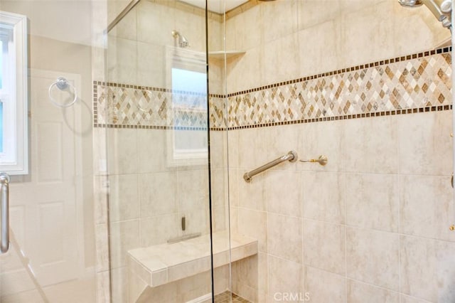 bathroom featuring tiled shower