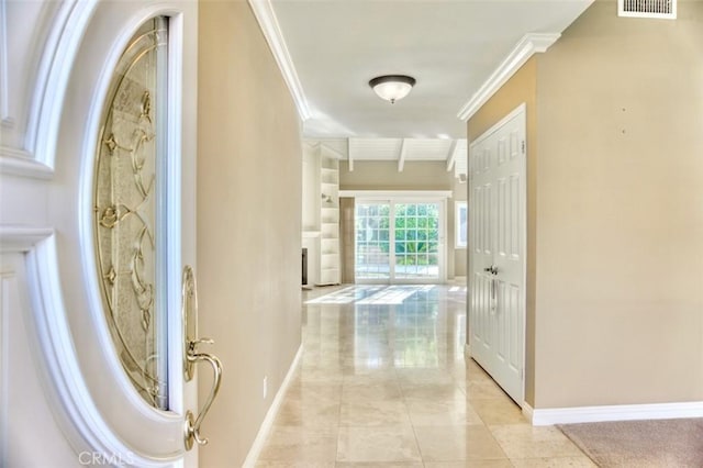 hall featuring light tile patterned floors and ornamental molding