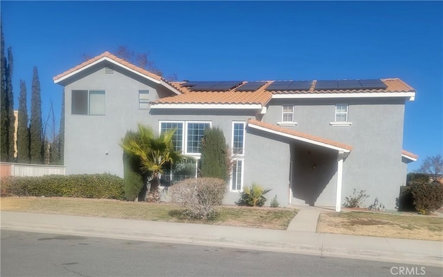 view of front of home with solar panels