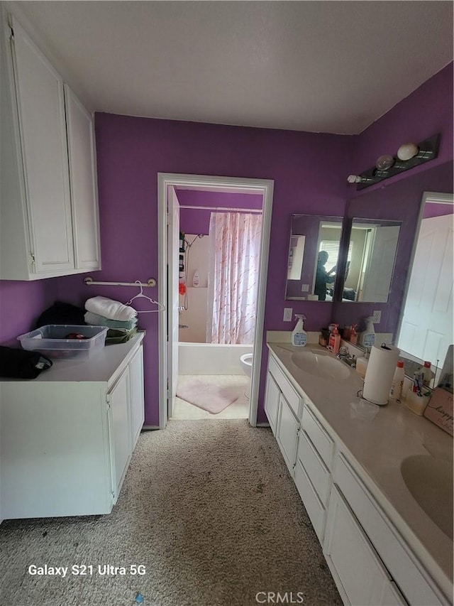 full bathroom with vanity, toilet, and shower / tub combo with curtain