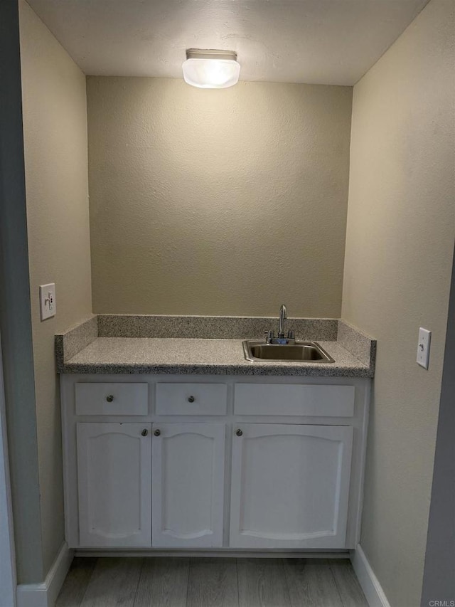 bathroom with wood-type flooring and vanity