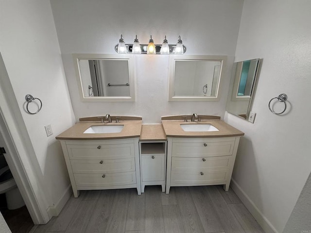 bathroom featuring vanity and hardwood / wood-style flooring