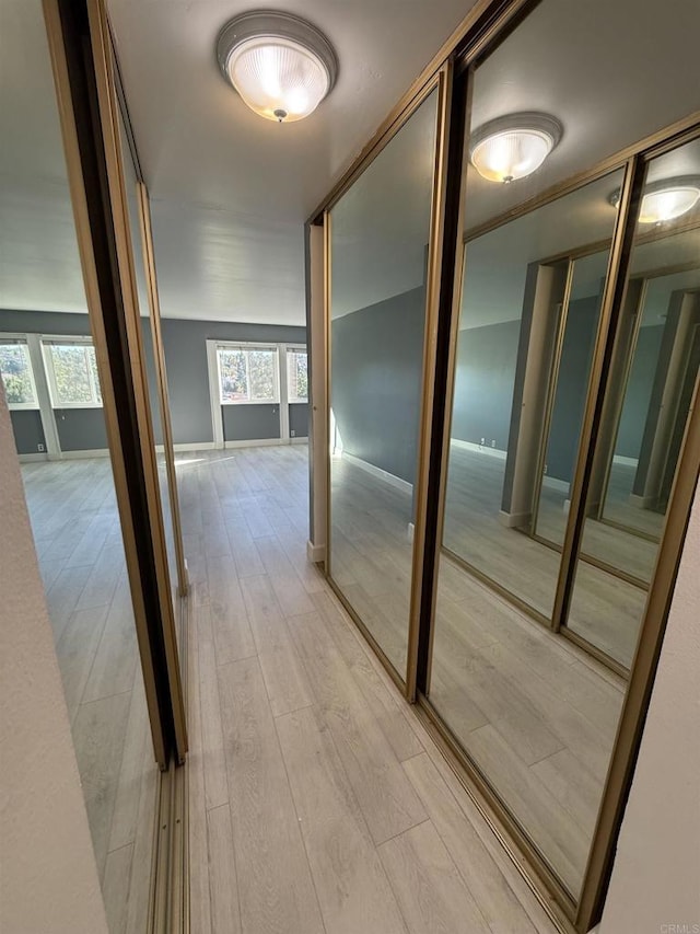 hallway featuring light hardwood / wood-style flooring