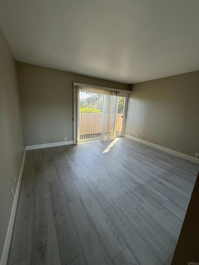 unfurnished room featuring light wood-type flooring