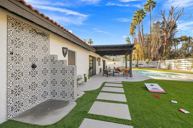 view of yard with a patio area, a fenced in pool, and an outdoor hangout area