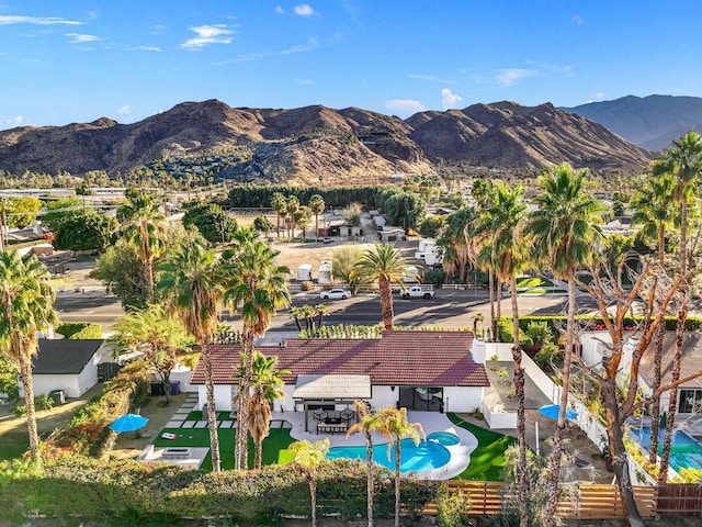 birds eye view of property with a mountain view