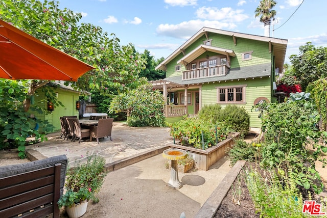 back of house featuring a patio