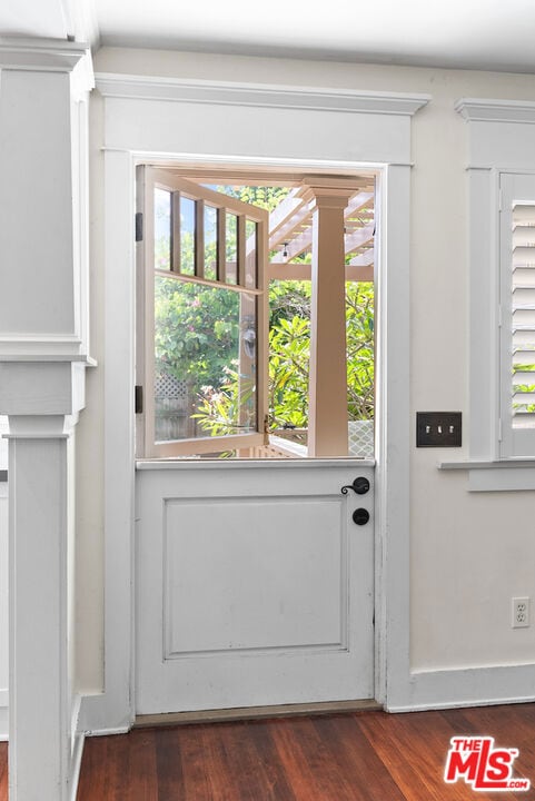 doorway to outside featuring dark hardwood / wood-style floors