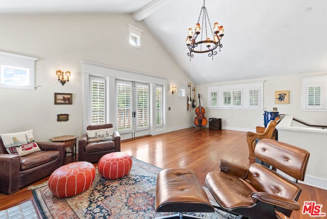 living room with hardwood / wood-style floors, french doors, and a healthy amount of sunlight