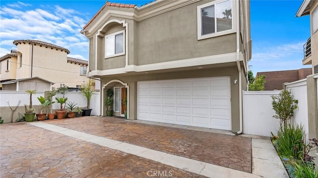 view of front of home with a garage