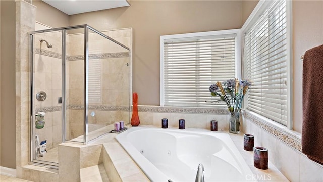 bathroom featuring separate shower and tub