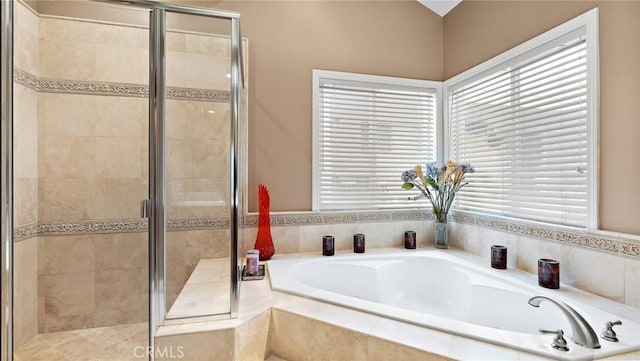 bathroom with separate shower and tub