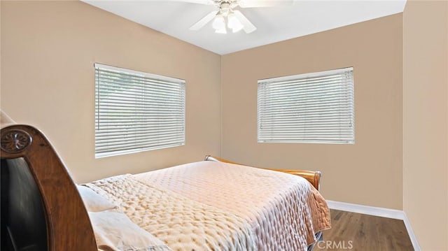 bedroom with ceiling fan and hardwood / wood-style floors