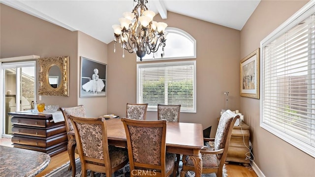 dining room with a notable chandelier, wood-type flooring, and lofted ceiling with beams