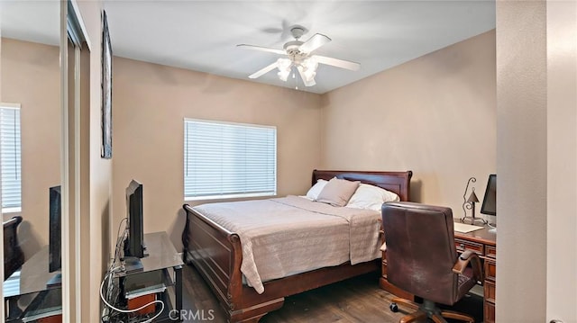 bedroom featuring ceiling fan and dark hardwood / wood-style flooring