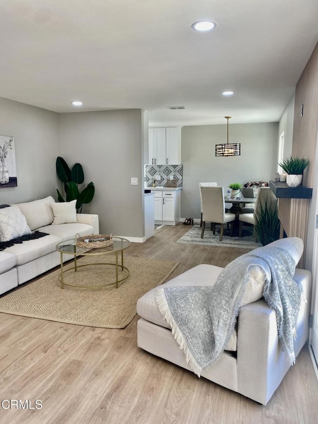 living room with light hardwood / wood-style floors