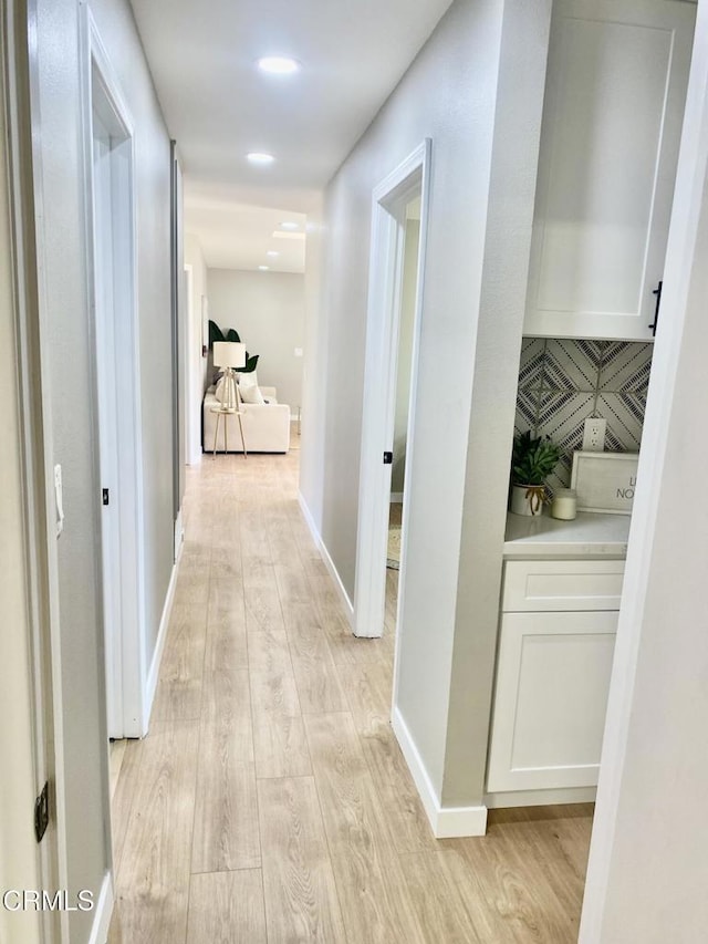 hallway featuring light wood-type flooring