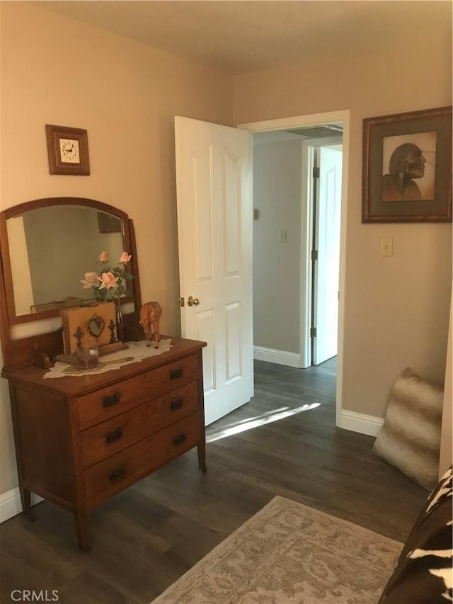 hallway with dark wood-type flooring