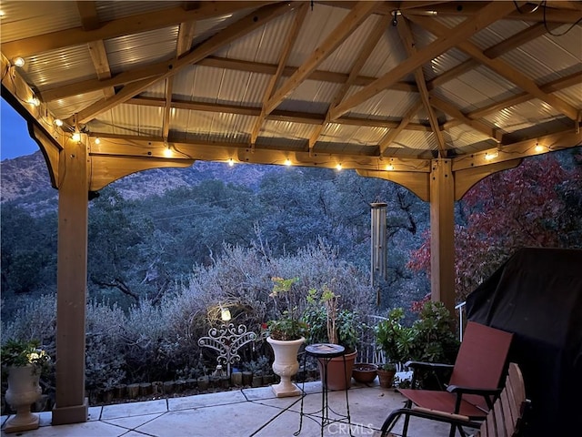 view of patio / terrace featuring a gazebo and a mountain view