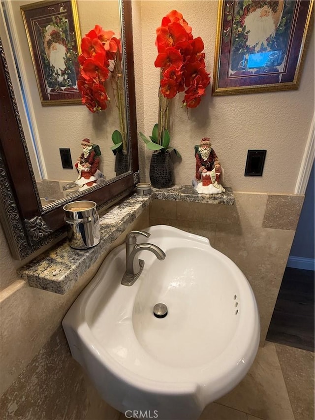 bathroom with tile patterned floors and sink