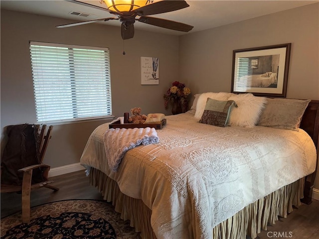 bedroom featuring ceiling fan and dark hardwood / wood-style floors