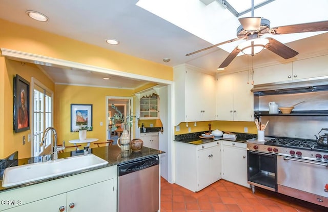 kitchen featuring white cabinetry, sink, light tile patterned floors, ceiling fan, and stainless steel appliances