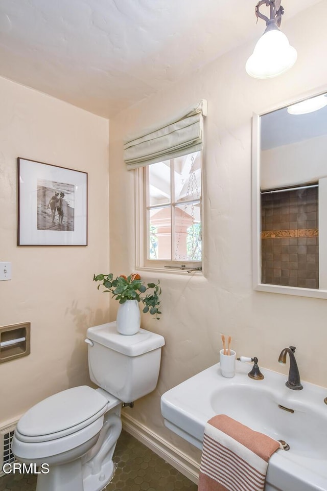 bathroom with sink and toilet