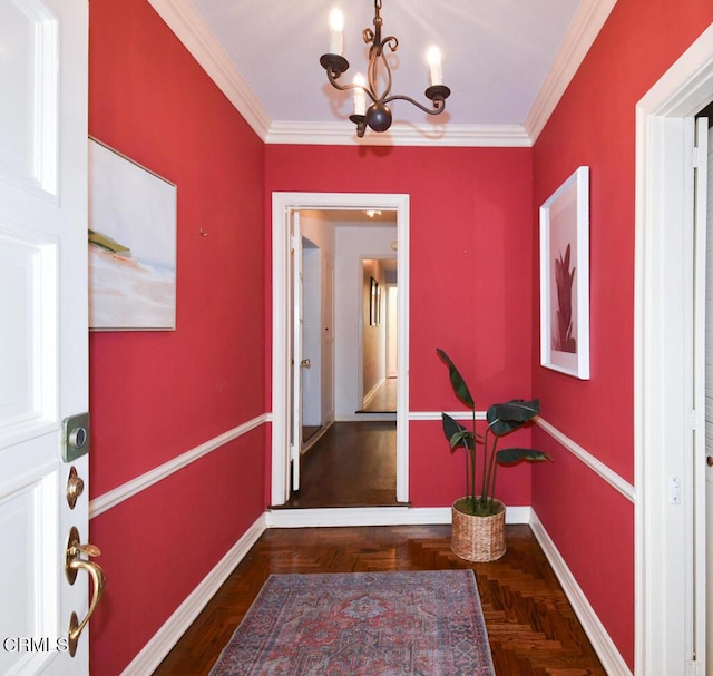 entryway featuring a notable chandelier, crown molding, and dark parquet floors