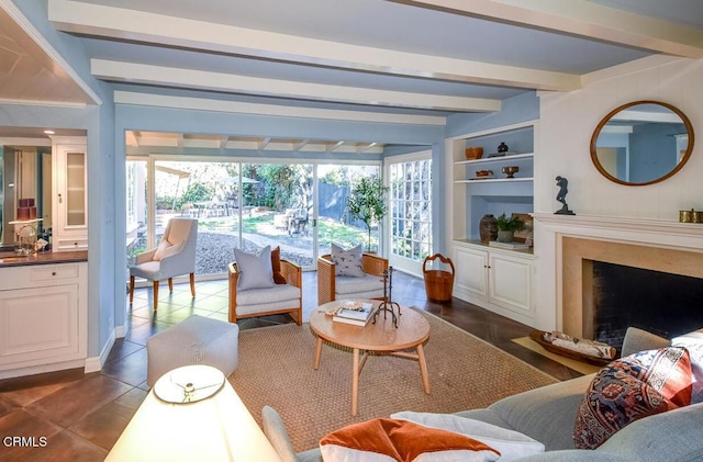 tiled living room with beamed ceiling, a premium fireplace, and built in shelves