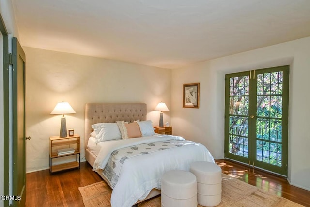 bedroom with dark wood-type flooring