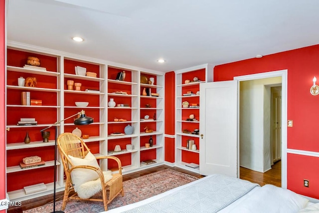 living area with hardwood / wood-style flooring