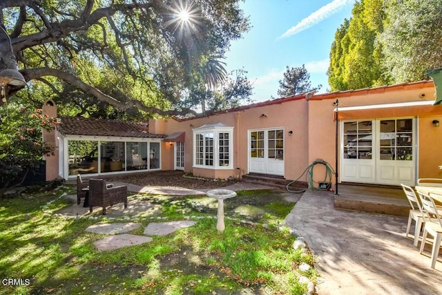 rear view of property with a patio