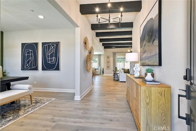 corridor featuring beam ceiling and light hardwood / wood-style floors