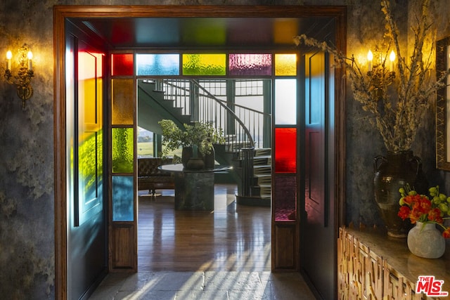 entryway with plenty of natural light and hardwood / wood-style floors