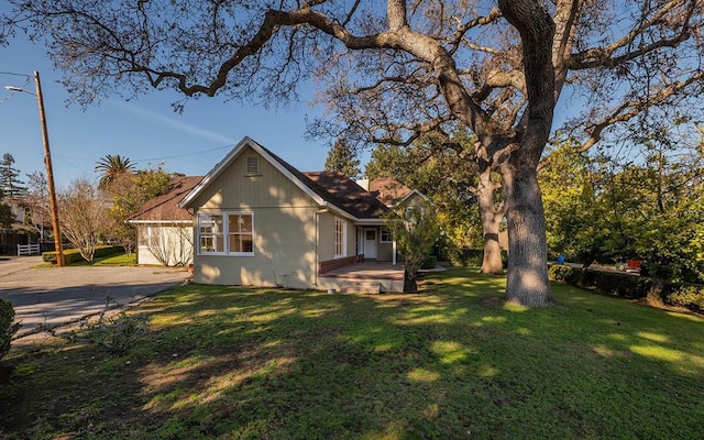 view of home's exterior with a yard