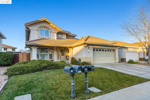 view of front of property with a garage and a front lawn