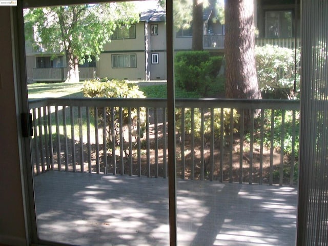 view of gate featuring a wooden deck